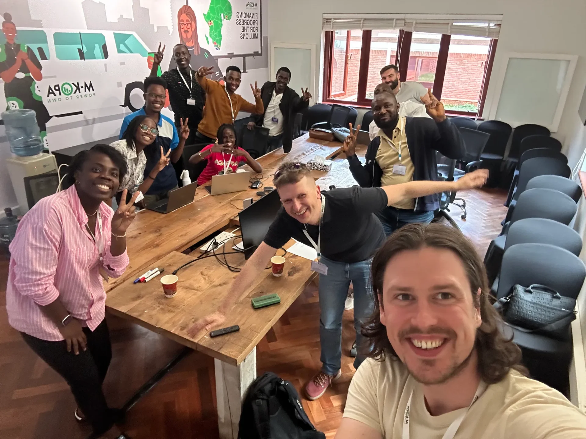 Adeola with the M-KOPA product team